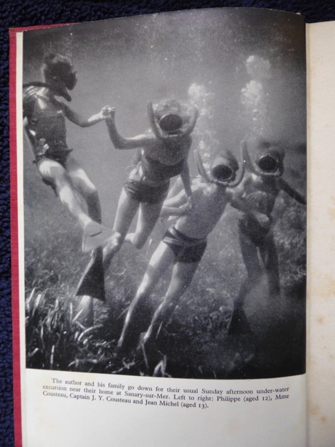 A page features an underwater photograph of 4 individuals in snorkeling gear. The text below the photo reads, the author and his family go down for their usual Sunday afternoon underwater excursion near their home at Sanary-sur-Mer.