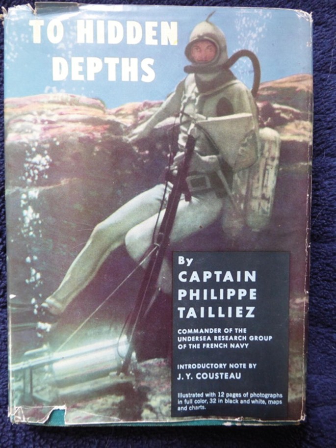 The front cover of the book Hidden depths by Captain Philippe Tailliez, commander of the undersea research group of the French Navy. An introductory note by J.Y. Cousteau, illustrated with 12 pages of photos in full color, 32 in black and white, maps and charts. It features a vintage photo of a diver in an underwater rocky terrain.