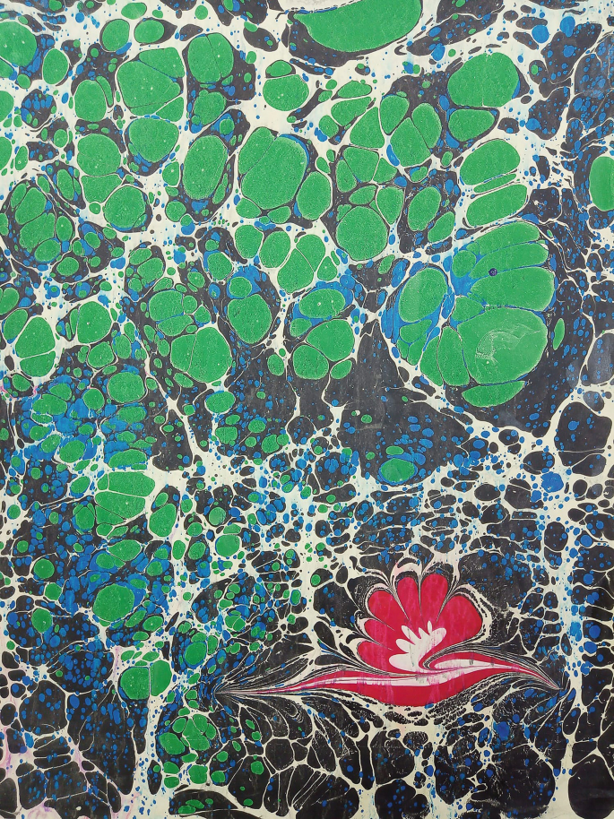 A painting with large and small stones of different colors and a seashell forming an intricate pattern.