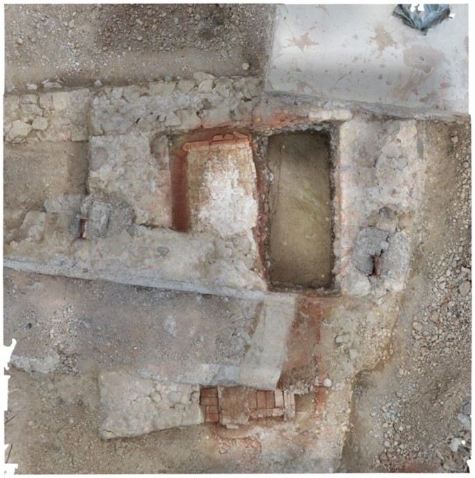 A photograph displays a monastery with evident structural damage and rust, highlighting the weathered condition of the building.