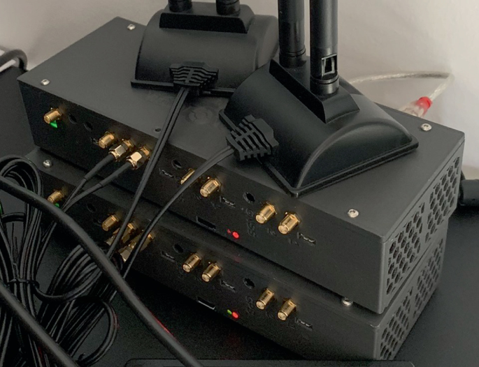 A photograph of the development kit's backside view. It is connected to the two-vehicle captain. The connected wires from the backside pins are displayed.
