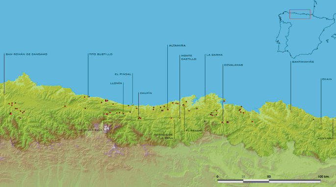 A topographical map depicts various geographical features and locations in the Cantabrian region. Some of the labeled locations are El Pindal, Altamira, La Garma, and Ekain. An inset map of Spain is in the upper right corner.