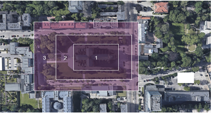 An aerial view of the building with 3 concentric rectangles marked. The inner rectangle highlights the building interior, followed by the exterior, and surroundings.