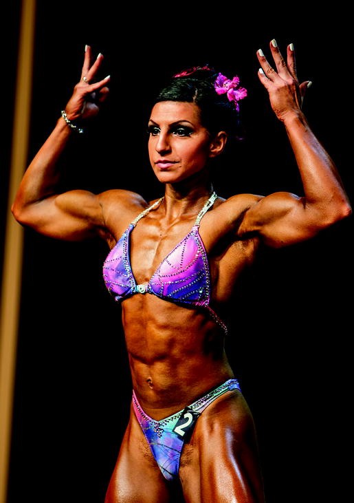 A photograph of a female bodybuilder in a bodybuilding competition.