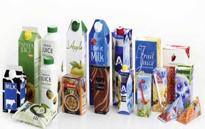 A photo of food items packed using tetra packs. They include packs of different fruit juices and milk products.