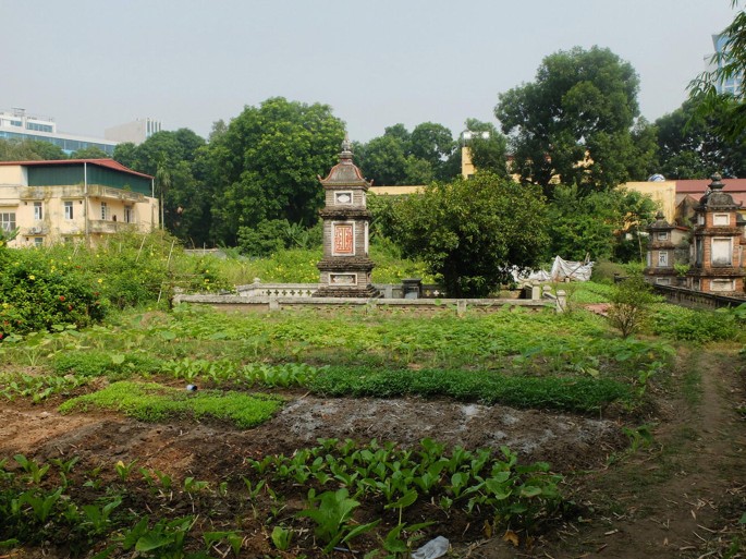 A photograph of buildings around a land area represents gardening.