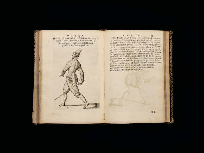 An opened old book. The left page is titled T E Z R A and has a paragraph at the top and a sketch of a man at bottom in a walking posture and has a sword in his hand. The right page is titled P A R T E and has a paragraph written on it.