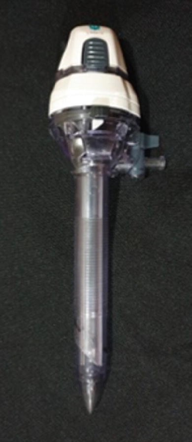 The figure exhibits the optical trocar. It consists of an awl, a cannula and a seal with a transparent tip.