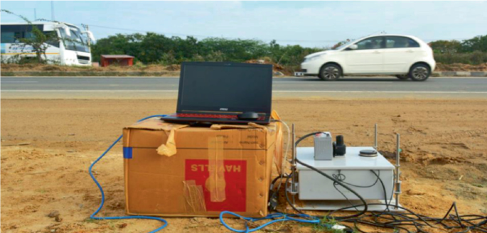 A photograph of the Transportable Infrared Traffic Logger arrangement beside the roadway.