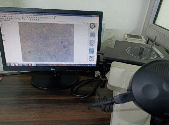 A photograph of a Metzer M E T Z 56 monocular incline metallurgical microscope.