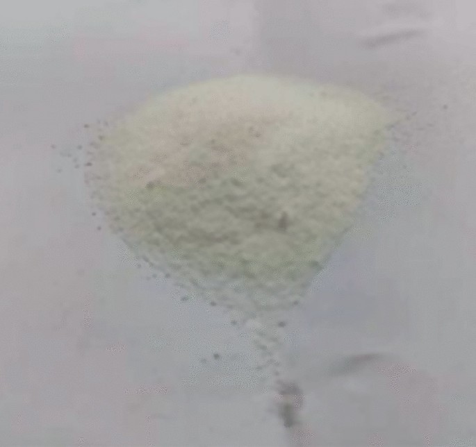 A photograph of fine grains of polycarboxylate water reducer.