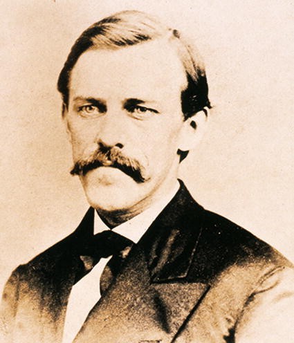 A photograph of William E Griffis.