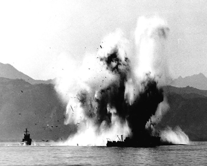 A photo of the explosion of mine field in the sea.