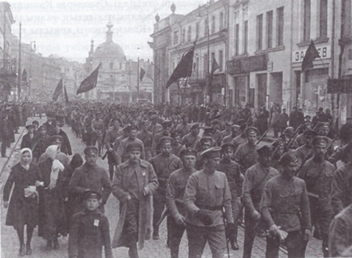 A photograph of a group of militants protesting with flags in their hands.