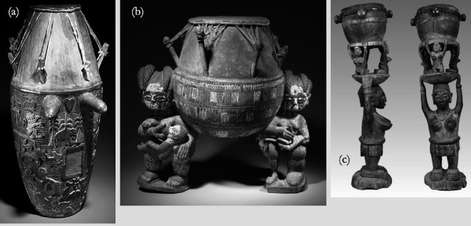 3 photos of statues. A, A drum with carvings on its lower surface and two knobs extending from the surface. b, A statue of two individuals, one a mother feeding a baby, while the other writes in a book using a pen, with a drum on their shoulders. c, 2 human figures are depicted carrying drums on their heads.