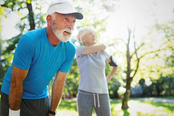 elderly couple jogging