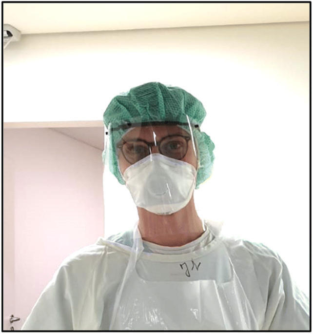 Doctors With Plastic Face Shields Surgical Masks Stock