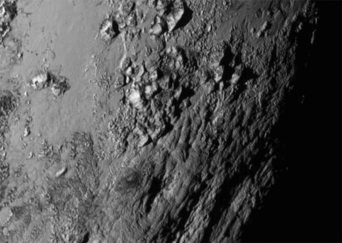 Pluto’s massive mountains hint at geological mysteries