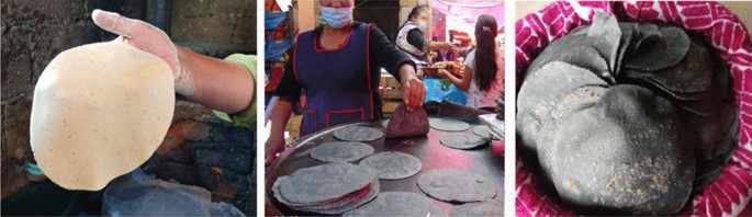 Woman makes corn tortillas by hand and cooks them on a large clay