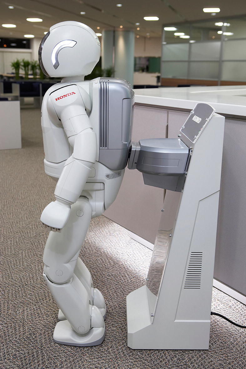 asimo is a robot with a human