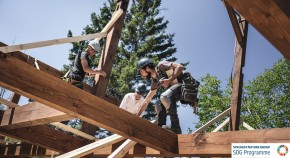 Men building and eco house, Quebec, Canada