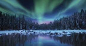 Winter landscape with aurora