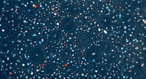 The Kepler orrery, a number of concentric circles and coloured dots representing exoplanetary systems, appears on a dark blue background.