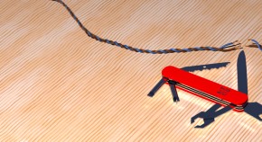 Swiss army knife with different tools next to a cut cable shaped like DNA helix