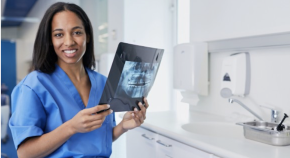 Associate dentist with x-ray