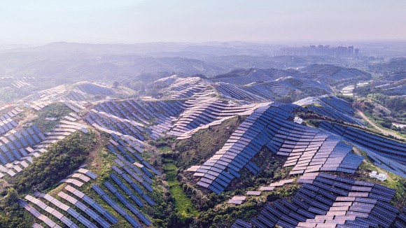 Solar panels decorate a mountain landscape in China.