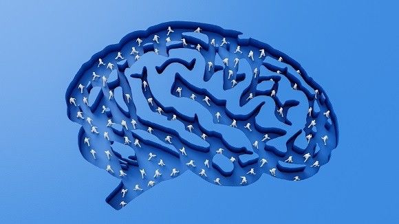 digital illustration of a blue human brain with tiny people walking around inside it