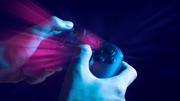 Two hands holding video game controller