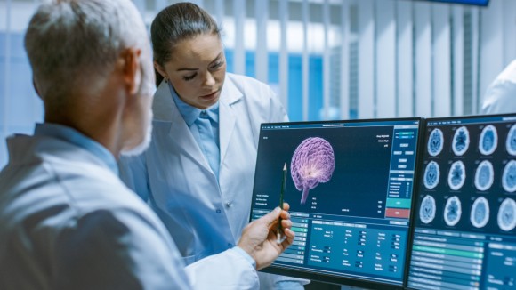 Two Medical Scientists in the Brain Research Laboratory Discussing Progress on the Neurophysiology Project Fighting Tumors.