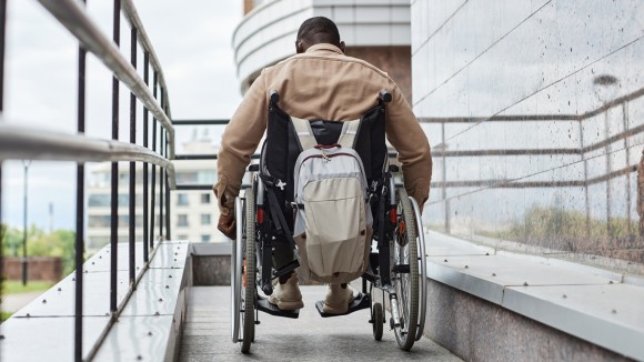Man in wheelchair on a ramp