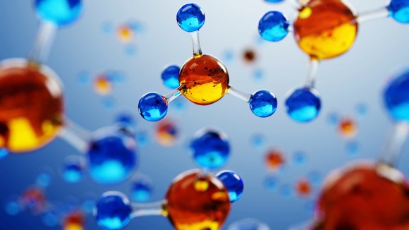 orange and blue 3d molecule models on blue background