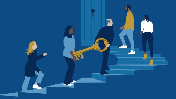 People walking up a set of stairs carrying a key to a door at the top of the stairs