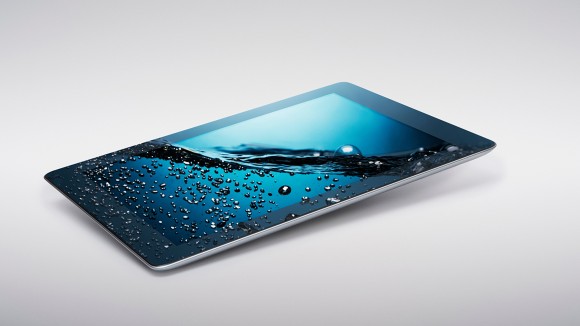 Digital tablet with gently rising bubbling water on screen - stock photo