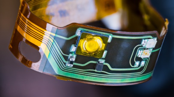 flexible acoustic sensor; Flex printed circuit and small electronic components in plastic strip curled into circle