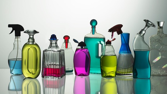 Different size and shaped bottles filled with different coloured liquids