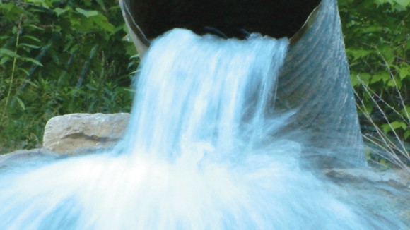 water gushing out of a pipe