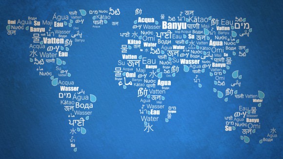 The image, with the word water in different languages on a global map, represents the unifying power of our world’s water resources.