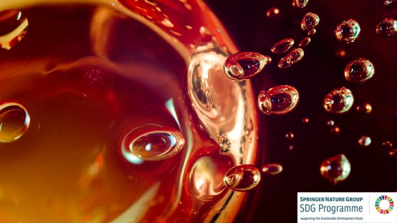 Light micrograph of air bubbles captured in transparent candle gel.