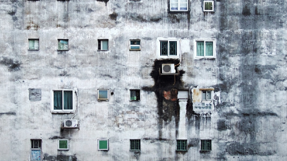 side of a rundown highrise building exterior