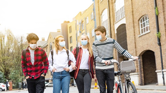 Group of teenagers wearing masks
