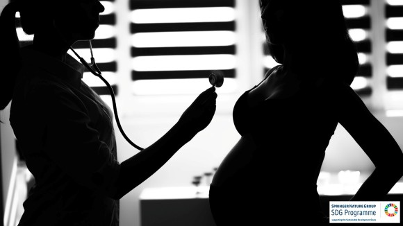 Silhouette female medicine doctor holding stethoscope to pregnant woman.