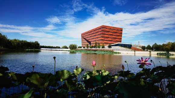 The library of Hebei University of Technology as seen across a body of water.