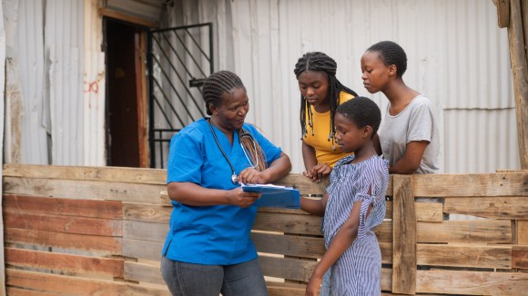 Nurse talking to teenage girls