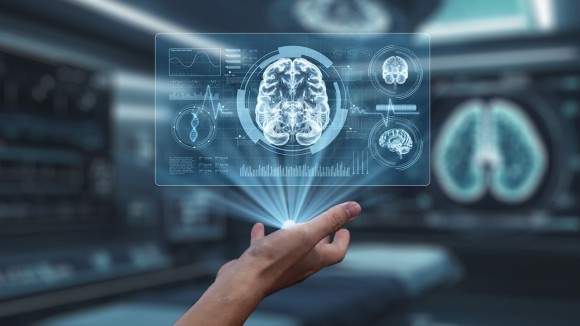 Close up of human hand holding brain holographic floating at lab. Salubrious