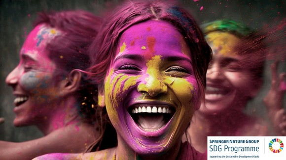 Image showing joyful woman with multicoloured paint powder on their faces, celebrating the Hindu Holi Festival.