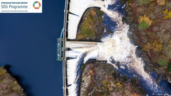 The view from a drone of water overflowing from a loch at a dam that is part of a hydro electricity generating scheme in south west Scotland.